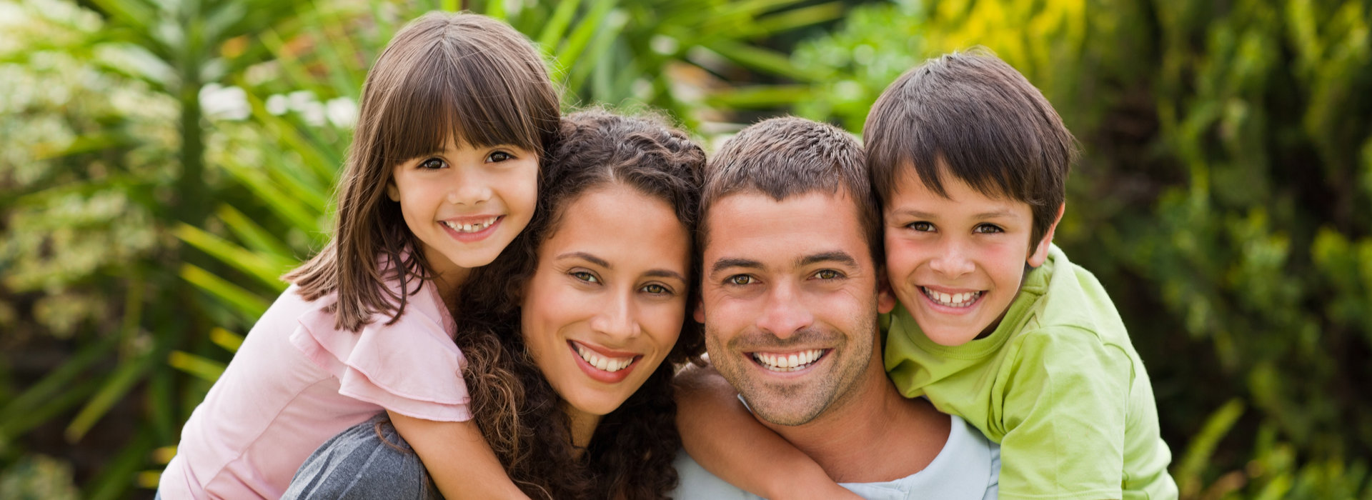 A beautiful family is smiling after family dentistry.
