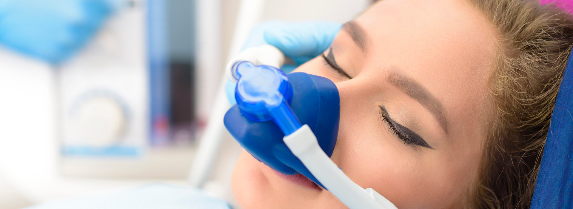 A woman receiving sedation dentistry.