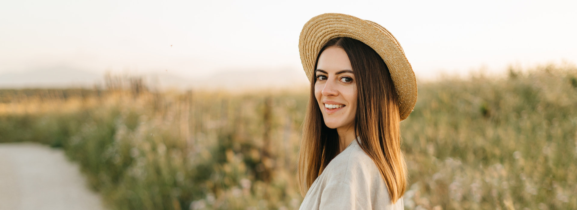 A beautiful woman is smiling after oral cancer screening.