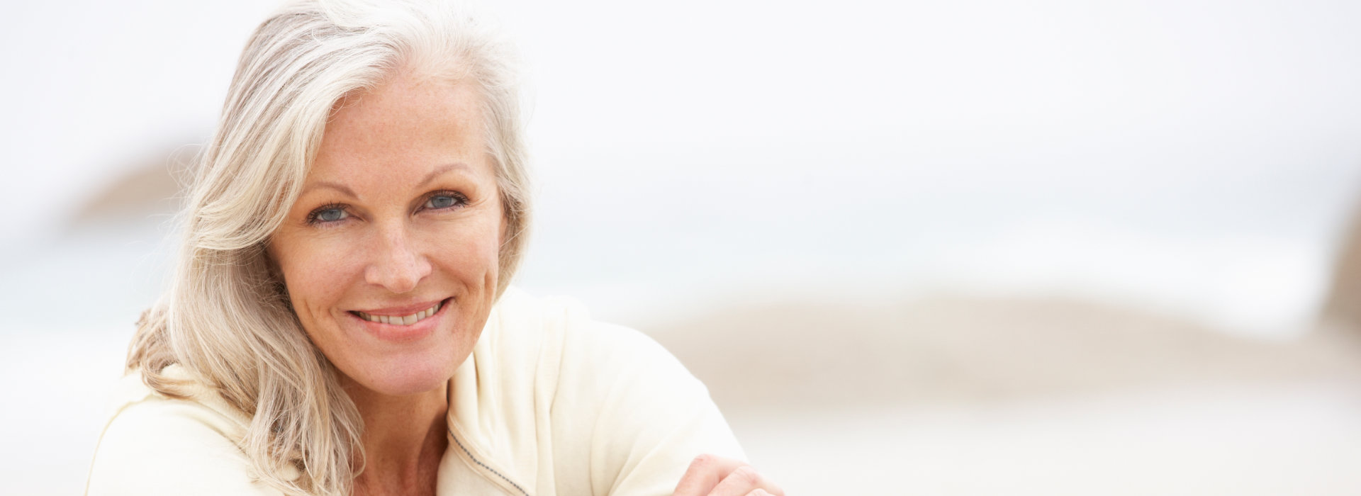 A beautiful woman is smiling.