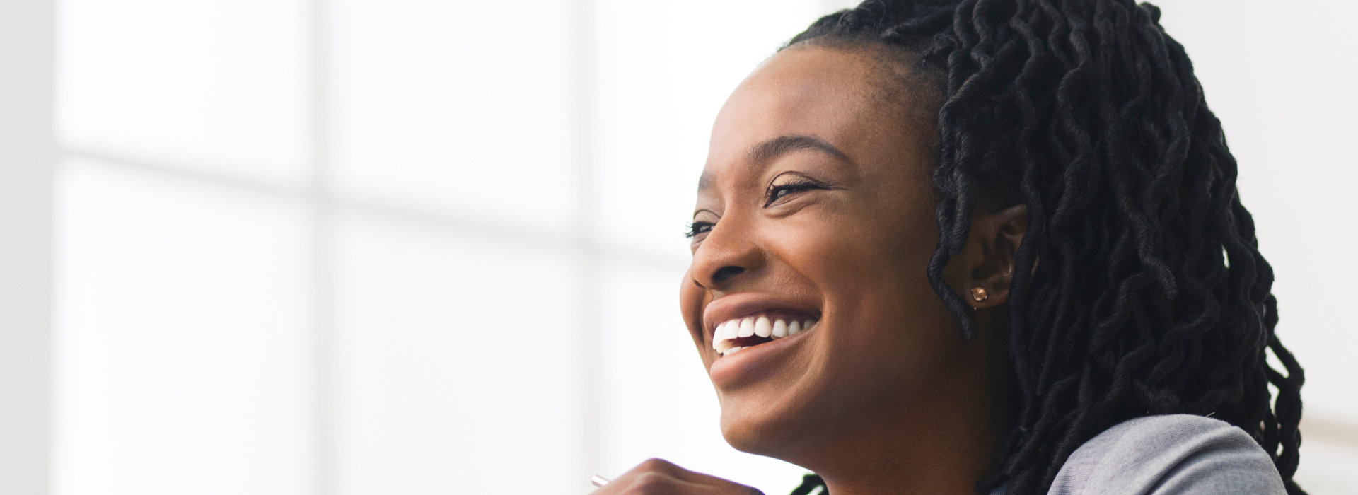 A beautiful woman is smiling after teeth whitening.