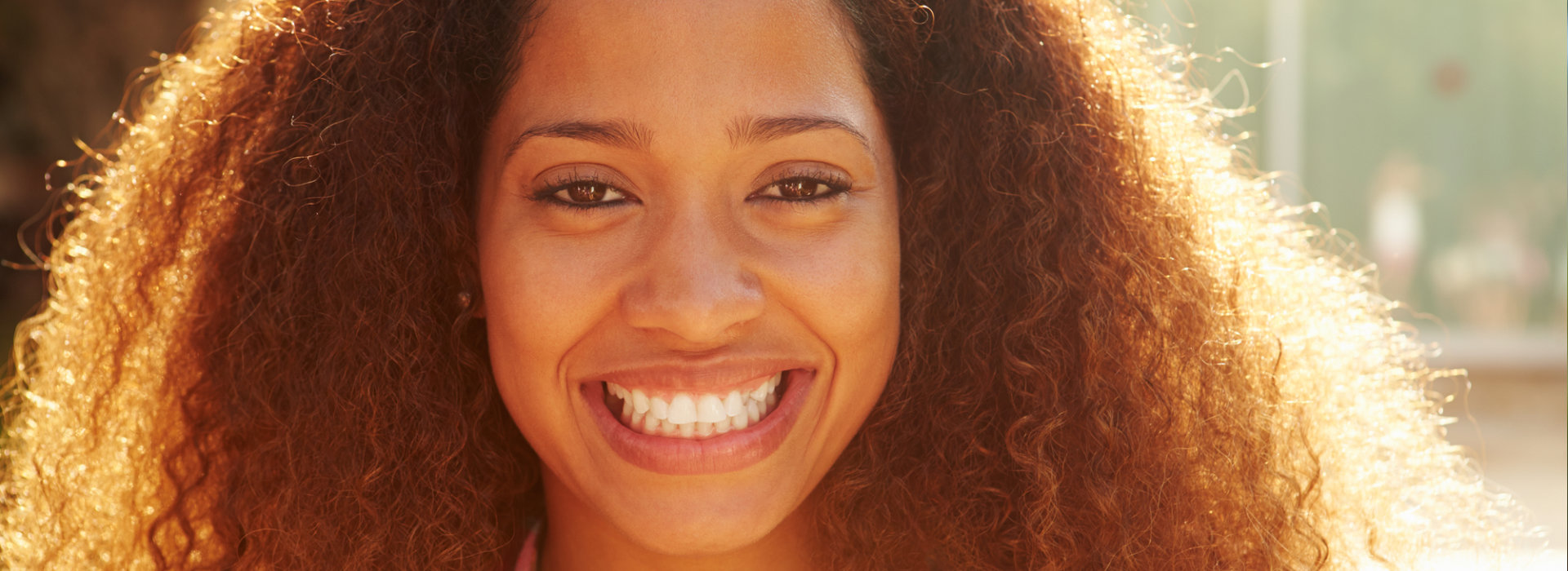 A woman is smiling.